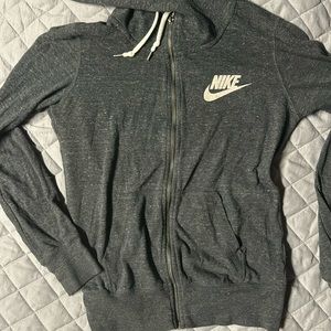 Women’s Nike size small zip up sweat shirt.